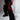 Black wide-leg pants featuring bold red dragon embroidery, styled with a black tank top and chunky black shoes.