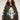 Oversized graphic sweatshirt featuring a religious illustration of the Virgin Mary with the text "Peace and Love" in bold colors, styled with a relaxed fit and long sleeves.